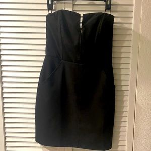 Strapless black cocktail dress with pockets
